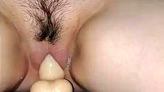 Handcuffed wife squirts cream over dildo wildly