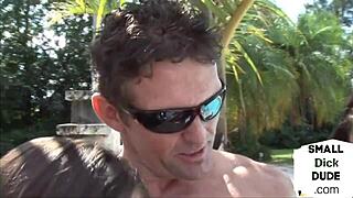 small cock sub trembles as dominas jerk him outdoors intensely