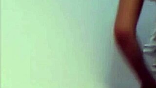 She rubs her wet pussy eagerly against tight pvc panties in lingerie.