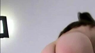 She rubs her wet pussy eagerly against tight pvc panties in lingerie.