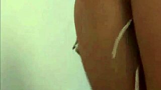 She rubs her wet pussy eagerly against tight pvc panties in lingerie.