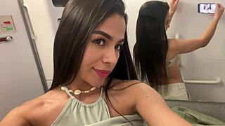 Passenger masturbates pussy with cream in airplane bathroom