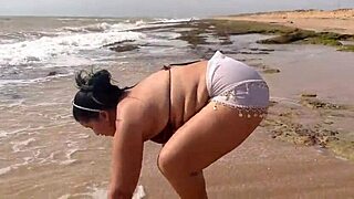 horny big ass latina masturbates wildly on sunny beach
