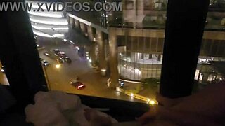 Petite babe fingers clit to orgasm outside hotel window