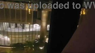 Petite babe fingers clit to orgasm outside hotel window