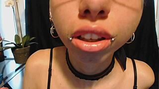cutie goth teen spits drool on nude lipstick teasing wet tongue