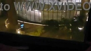 Petite babe fingers clit to orgasm outside hotel window