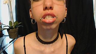 cutie goth teen spits drool on nude lipstick teasing wet tongue