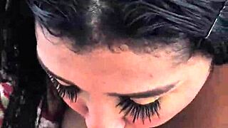 Her intense brown eyes captivate as she shows off huge tits