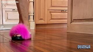 she slips from furry slippers to bare toes in kitchen