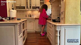 she slips from furry slippers to bare toes in kitchen