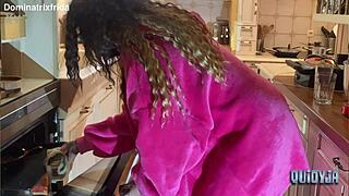 she slips from furry slippers to bare toes in kitchen