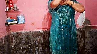 Cute Indian wife strips in bathroom flashing clean pussy and huge boobs