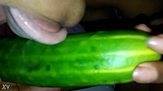 Young ebony beauty elegantly teases with cucumber toy masturbation