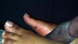 Smooth ebony feet tease and stroke hard shaft in steamy amateur session