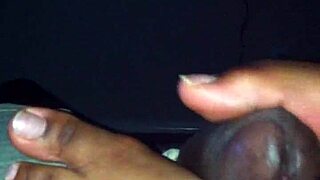 Smooth ebony feet tease and stroke hard shaft in steamy amateur session