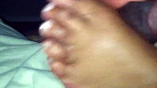 Smooth ebony feet tease and stroke hard shaft in steamy amateur session