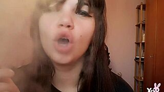 Romanian femdom goddess smokes cigarette showing big bare pussy lips up close