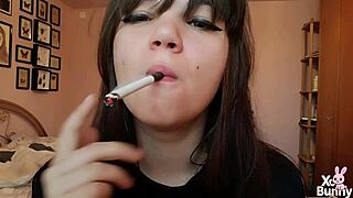 Romanian femdom goddess smokes cigarette showing big bare pussy lips up close