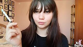 Romanian femdom goddess smokes cigarette showing big bare pussy lips up close