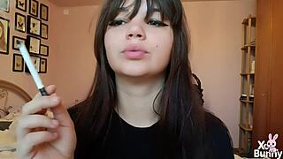 Romanian femdom goddess smokes cigarette showing big bare pussy lips up close