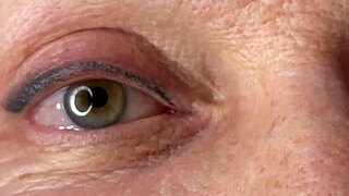 mature lady takes massive facial cumshot right on her eye