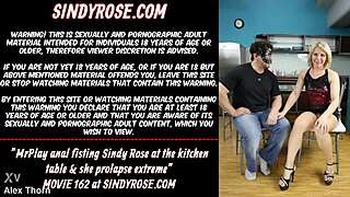 MrPlay delivers extreme anal fisting to Sindy Rose on kitchen table prolapse