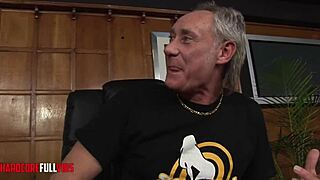 the busty blonde moans as two guys fuck her from behind doggystyle