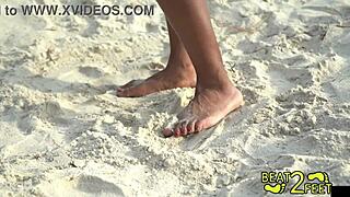 giggling as my soft feet rub and tease that giant hot rock all over on the beach