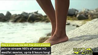 giggling as my soft feet rub and tease that giant hot rock all over on the beach