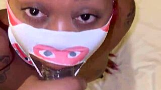 masked figure delivers intense deep throat action