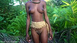 perfect dark african beauty dances half naked in village raffia outdoors