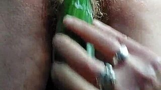 granny stuffs hairy pussy with thick cucumber deep