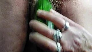 granny stuffs hairy pussy with thick cucumber deep