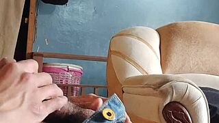 he strokes his throbbing cock alone in the living room shadows