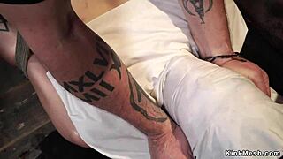 brunette hogtied in one-leg suspension endures rough choking fuck