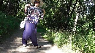 hairy mature lifts skirt flashing her beaver in the public park