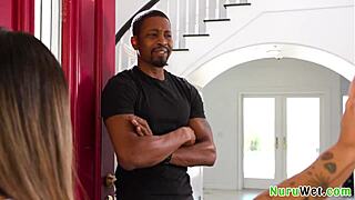 Petite busty tattooed Asian masseuse glides wet Nuru over black client's monster cock