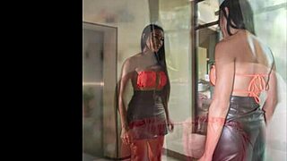 sindy slips into orange swimsuit for kinky shemale shoot