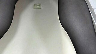 Sexy blonde mature milf strips in stockings heels fingering hairy pussy close up.