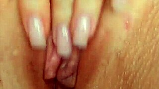 A young babe with big pussy lips masturbates her juicy clit to dripping orgasm close up