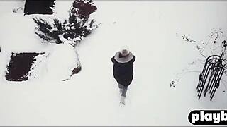 Sensual couple shares intimate winter day embrace in snow