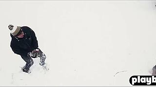 Sensual couple shares intimate winter day embrace in snow