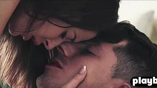 Sensual couple shares intimate winter day embrace in snow