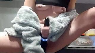 young woman pleasures herself on the kitchen counter