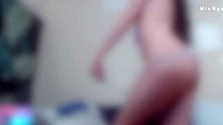 mia nyx teases her pink hairy pussy through see-through lingerie before stripping