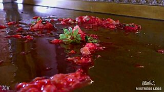 cute wrinkled barefoot toes squeeze juicy strawberry closeup on dresser dirty foot fetish
