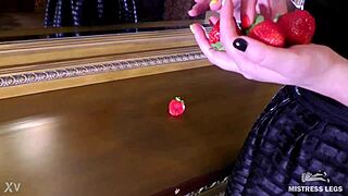 cute wrinkled barefoot toes squeeze juicy strawberry closeup on dresser dirty foot fetish