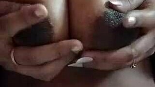 desi indian wife squeezes her big lactating milk boobs