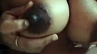 desi indian wife squeezes her big lactating milk boobs